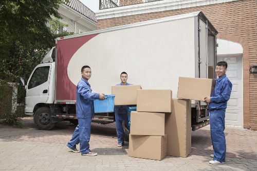 Removal team sorting recyclable packing materials in Highbury