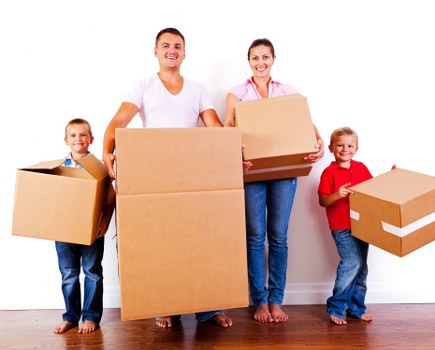 Removal team preparing furniture safely before a move