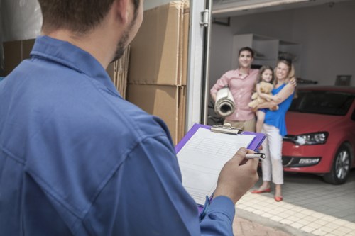 Home removal crew handling furniture in Highbury