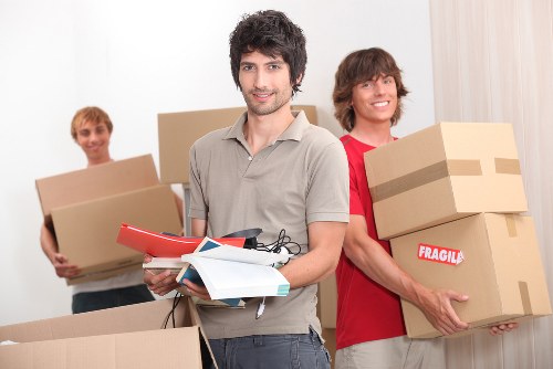 Local furniture collection team removing bulky household items