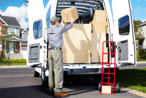 Professional movers loading furniture in Highbury