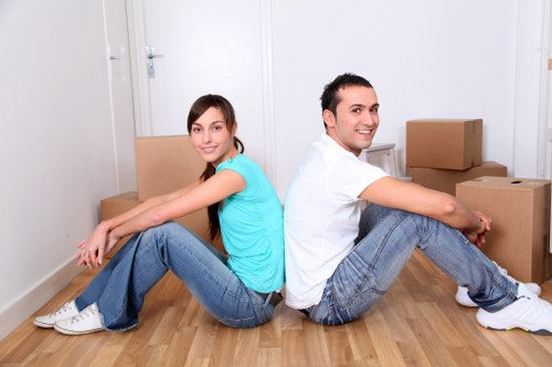 Moving furniture through a narrow Highbury staircase with protection