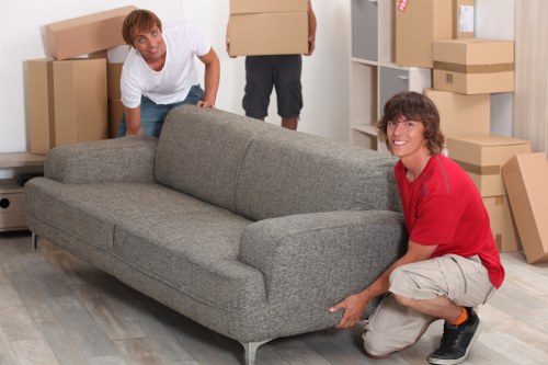 Professional movers packing belongings for a Highbury relocation
