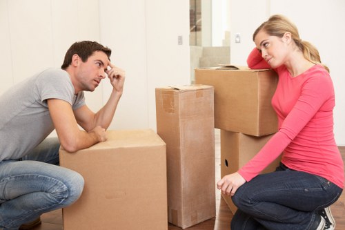 Moving team in Highbury packing household items for relocation